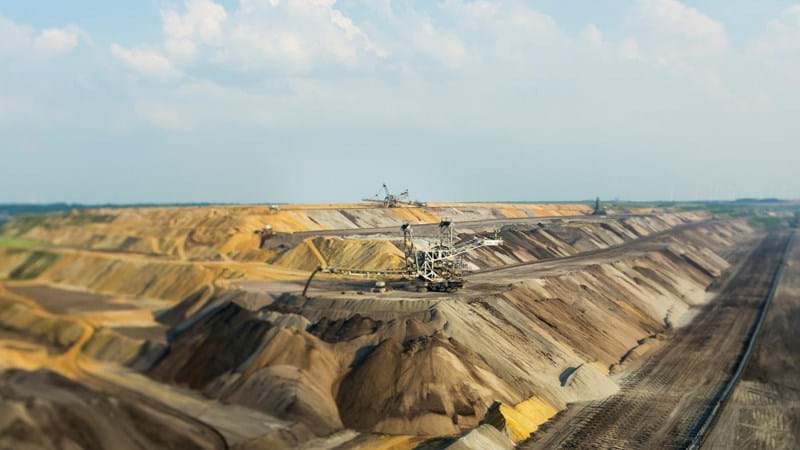 Excavating taking place in a large quarry.