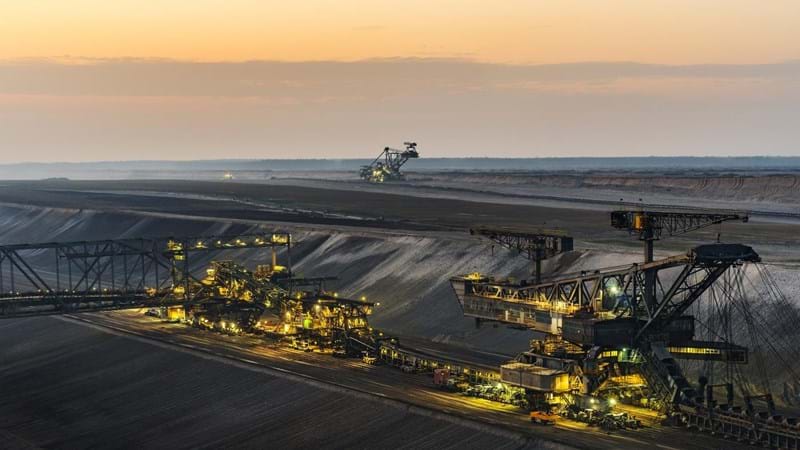 An open pit mine at dusk.