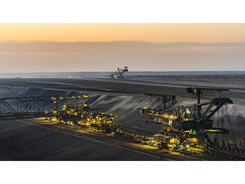 An open pit mine at dusk.