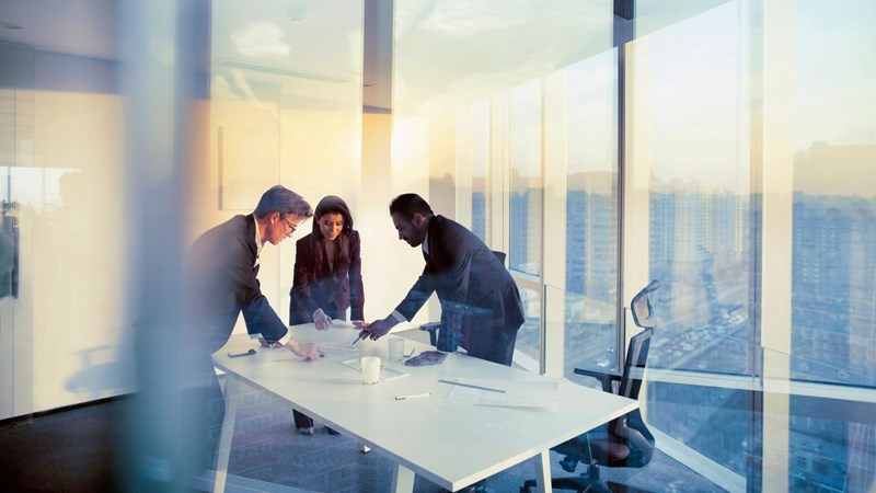 Adult senior diverse multi-ethnic Caucasian Hispanic Middle Eastern CEO executive team business people together in conference meeting room in contemporary modern office bright sunny daylight sunset dusk talking discussing planning organizing strategy well dressed suit and tie teamwork cooperation diversity multi-ethnic problems solutions unity cityscape downtown urban new beginnings breaking new ground dreamlike decisions choices the way forward diversity