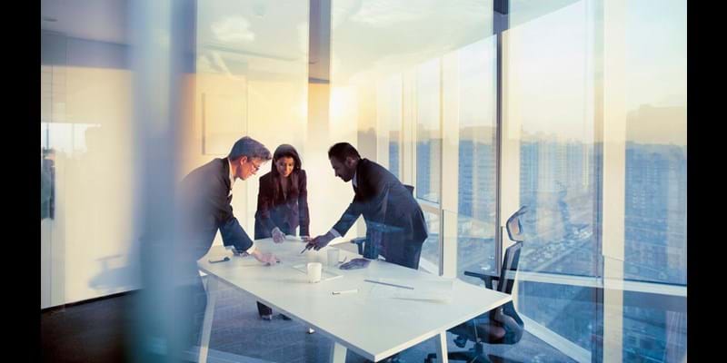 Adult senior diverse multi-ethnic Caucasian Hispanic Middle Eastern CEO executive team business people together in conference meeting room in contemporary modern office bright sunny daylight sunset dusk talking discussing planning organizing strategy well dressed suit and tie teamwork cooperation diversity multi-ethnic problems solutions unity cityscape downtown urban new beginnings breaking new ground dreamlike decisions choices the way forward diversity