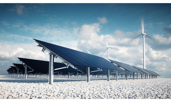 Solar panels and wind turbines in the desert.