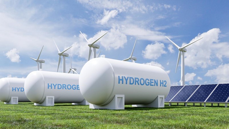 A render of a group of hydrogen tanks, solar panels and wind turbines.