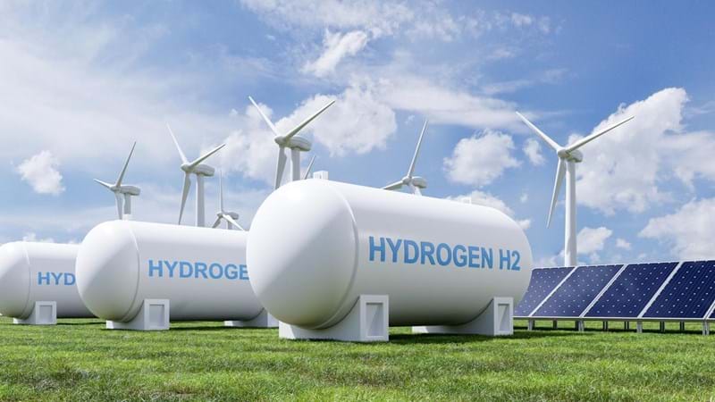 A render of a group of hydrogen tanks, solar panels and wind turbines.