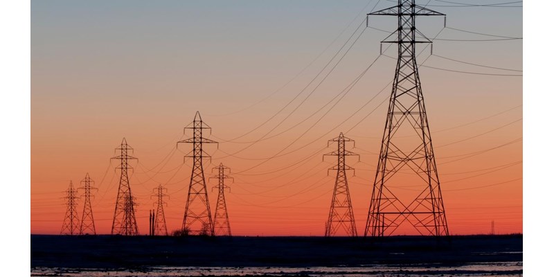 Electricity pylons at sunset.
