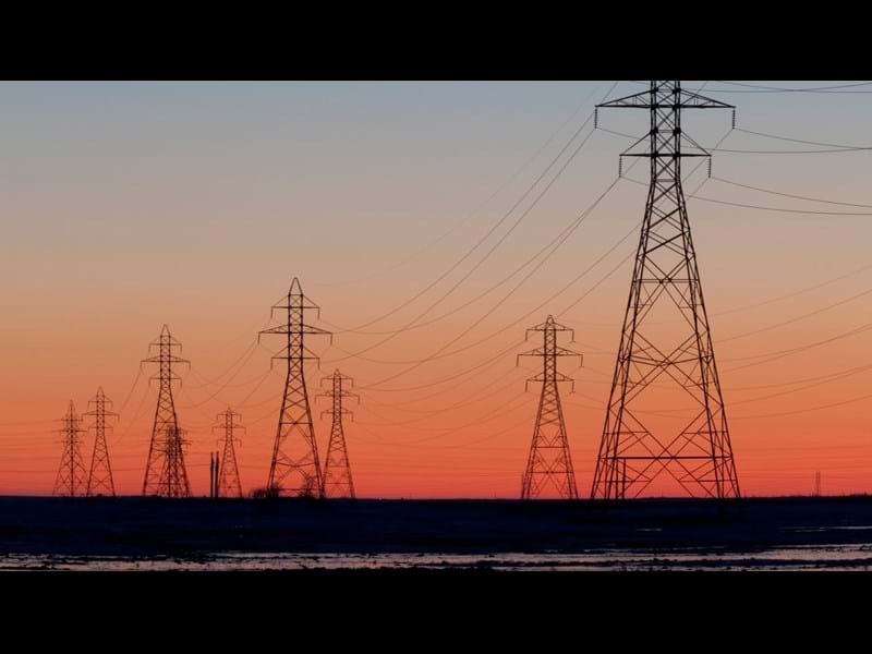Electricity pylons at sunset.
