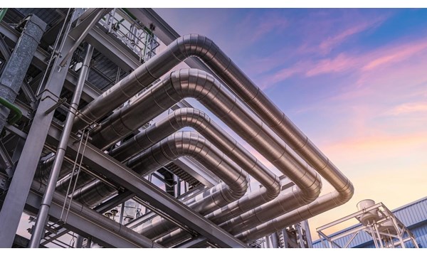 The pipe of factory, close-up of industrial steel pipelines at oil-refinery plant and sky.