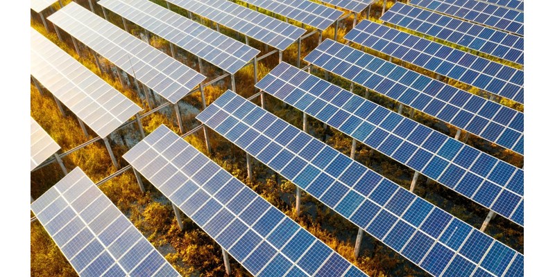 Rows of solar panels in a field.