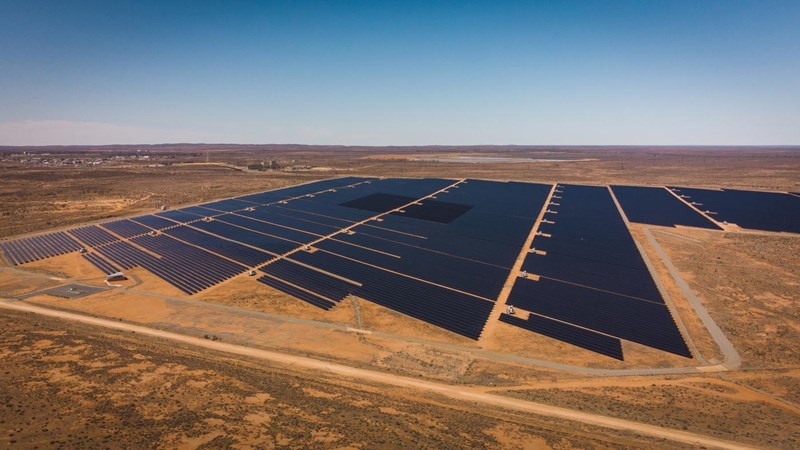 An aerial view of a solar farm in the desert.