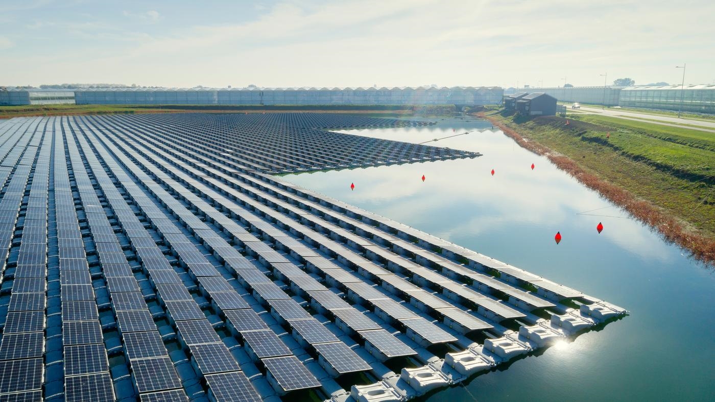 Countless rows of solar panels, floating on a pond.