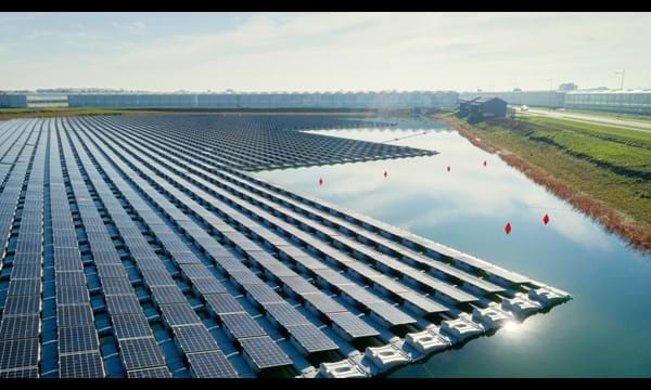 Countless rows of solar panels, floating on a pond.