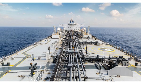 The deck of a large oil tanker in the ocean.