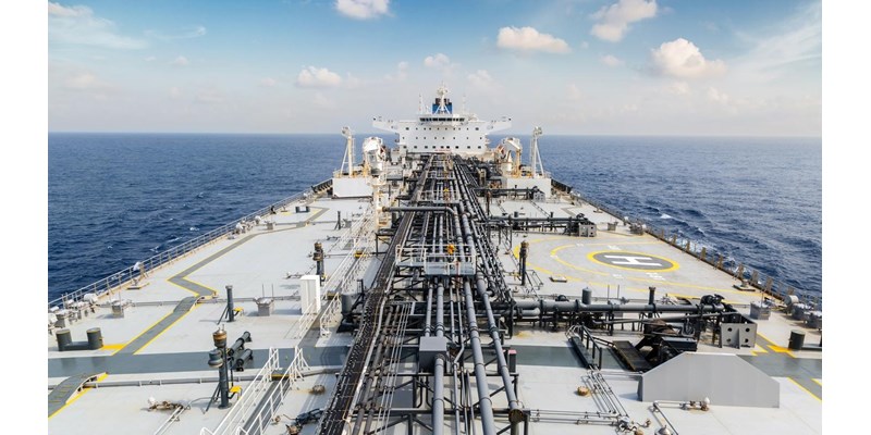 The deck of a large oil tanker in the ocean.