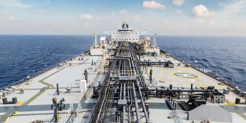 The deck of a large oil tanker in the ocean.
